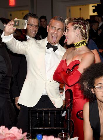 Andy Cohen and Miley Cyrus take a selfie during the amfAR Inspiration Gala