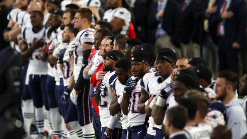 MINNEAPOLIS, MN - FEBRUARY 04: The New England Patriots stand during the National Anthem prior to Super Bowl LII against the Philadelphia Eagles at U.S. Bank Stadium on February 4, 2018 in Minneapolis, Minnesota.  (Photo by Gregory Shamus/Getty Images)