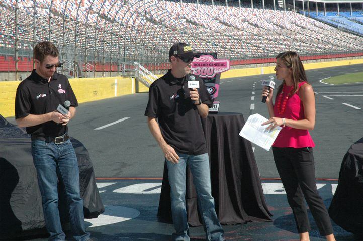IMAGES: NASCAR drivers, breast cancer survivors paint pit road pink