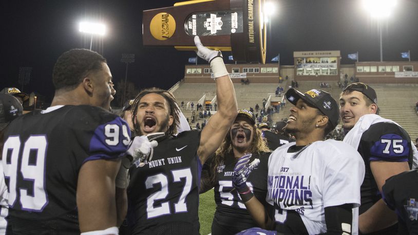 Mount Union’s Gabe Brown(27) celebrates with his teammates after defeating Mary Hardin-Baylor during the second half of the Amos Alonzo Stagg Bowl NCAA Division III college football championship Friday, Dec.15, 2017, in Salem,Va. (AP Photo/Lee Luther Jr.)