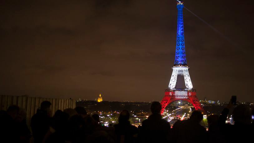 The Eiffel Tower illuminated in national colors, three days after terrorist attacks in Paris, Nov. 16, 2015. The Louvre and the Eiffel Tower reopened to the public Monday afternoon after being closed following Friday's terrorist attacks. (Pierre Terdjman/The New York Times)