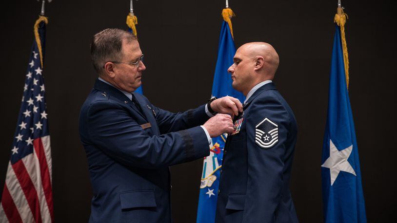 The Bronze Star was presented to Master Sgt. Timothy L. Heggedahl, an intelligence analyst, by Brig. Gen. James Dienst, commander of the Air Force Research Laboratory’s 711th Human Performance Wing, during a ceremony at the Air Force Institute of Technology, Wright-Patterson Air Force Base, on Feb. 26, 2020.  (U.S. Air Force photo/Richard Eldridge)